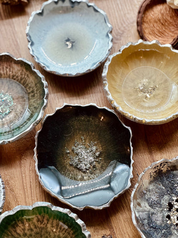 Resin jewelry bowls in various colors with silver