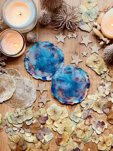 2 resin coasters in shades of blue