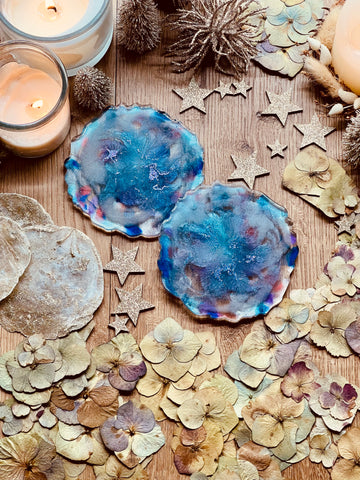 2 resin coasters in shades of blue