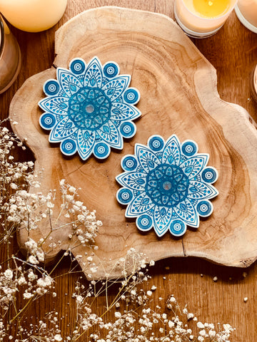 2 mandala resin coasters in white with blue