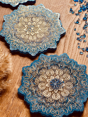 4 mandala resin coasters in blue with gold