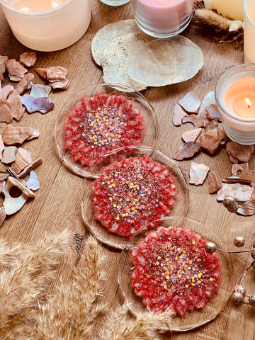 3 resin coasters in pink with silver