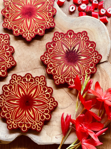 4 wintery resin coasters in red with gold