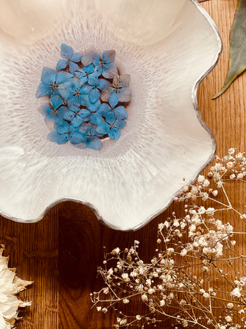 White resin bowl with silver and blue hydrangeas